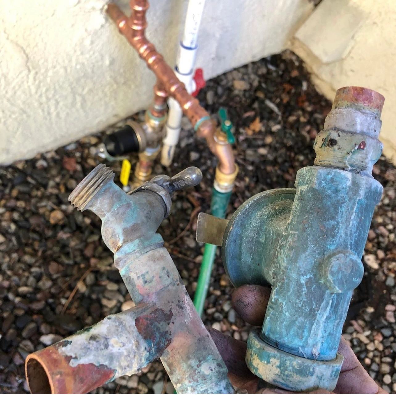 Corroded hose bibs and valves removed during a repair